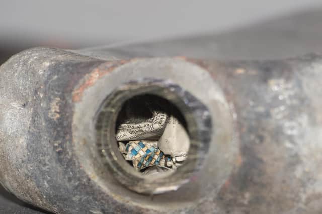 The first task was to saw the top off the lead bottle. Picture: Neil Hanna.