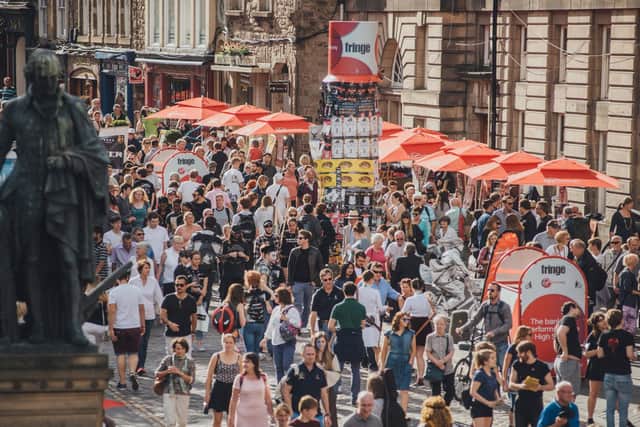Huge crowds throng the Royal Mile in August for free street entertainment during the Fringe.